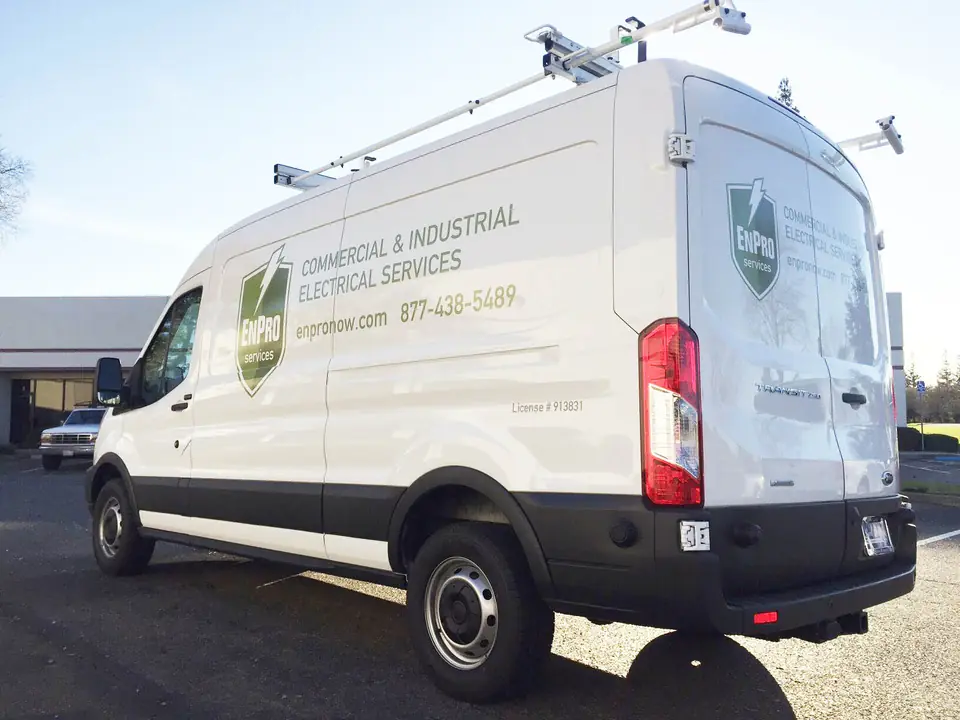 White work van with graphics for a commercial and industrial electrical contractor