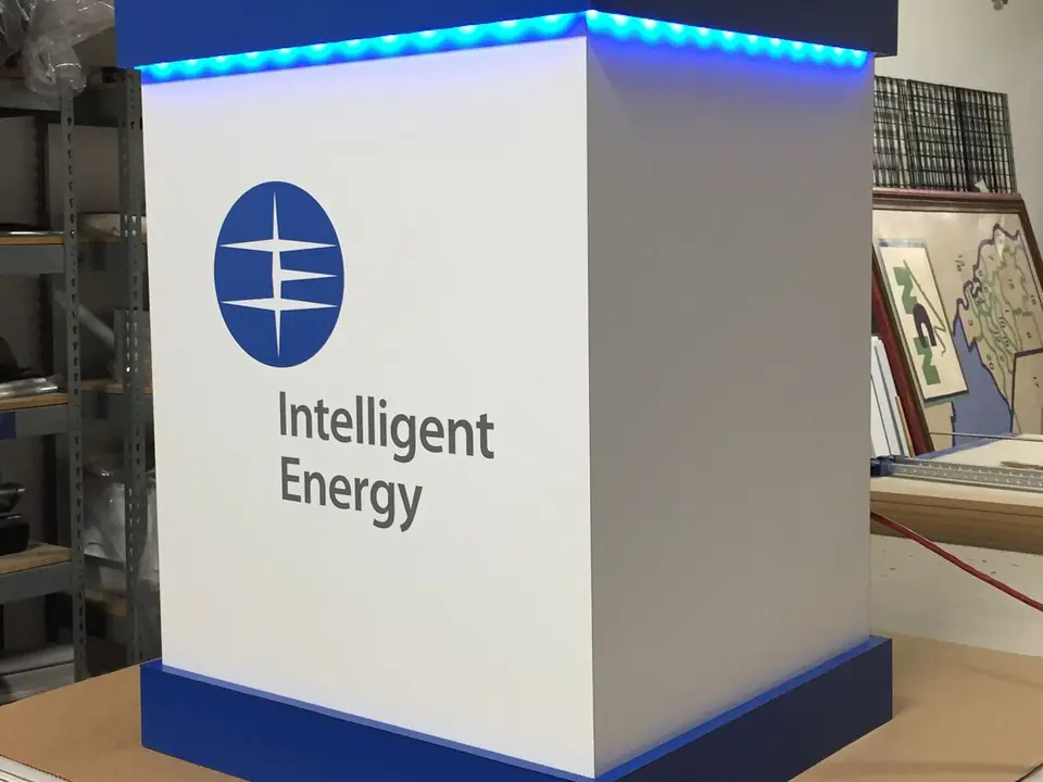 Display kiosk with an Intelligent Energy logo and blue LED trim